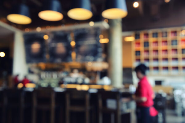 Crowded restaurant interior with multiple conversations and ambient noise