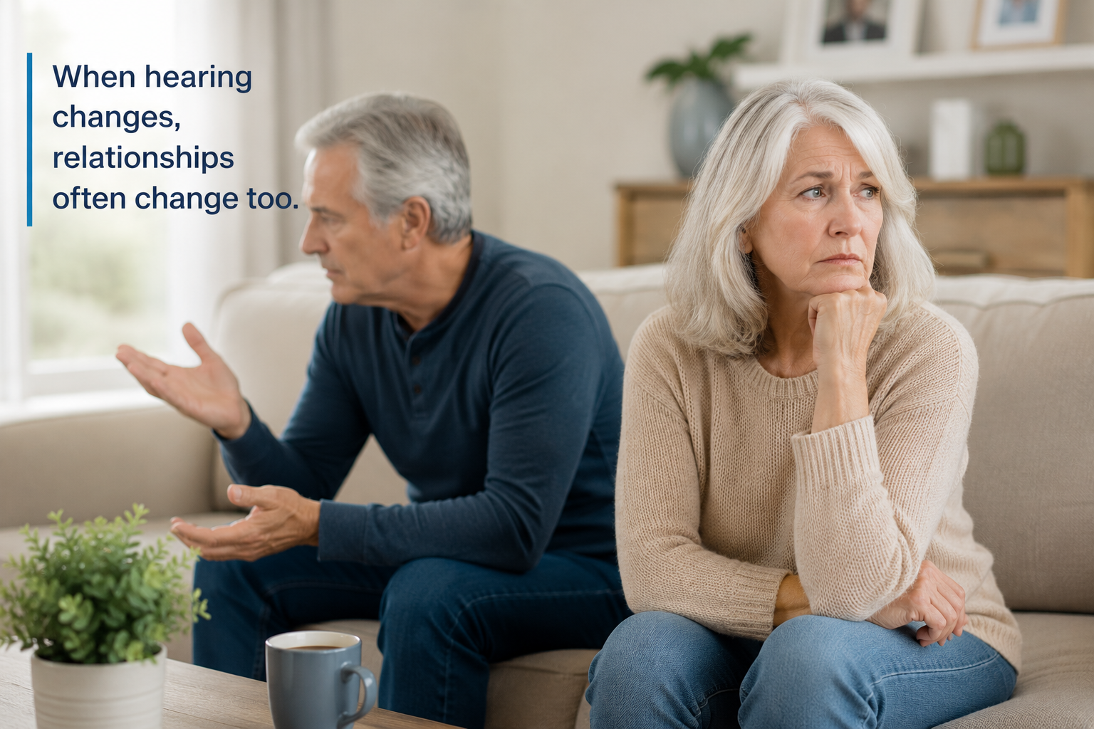 Older couple sitting apart on a couch appearing frustrated during conversation at home